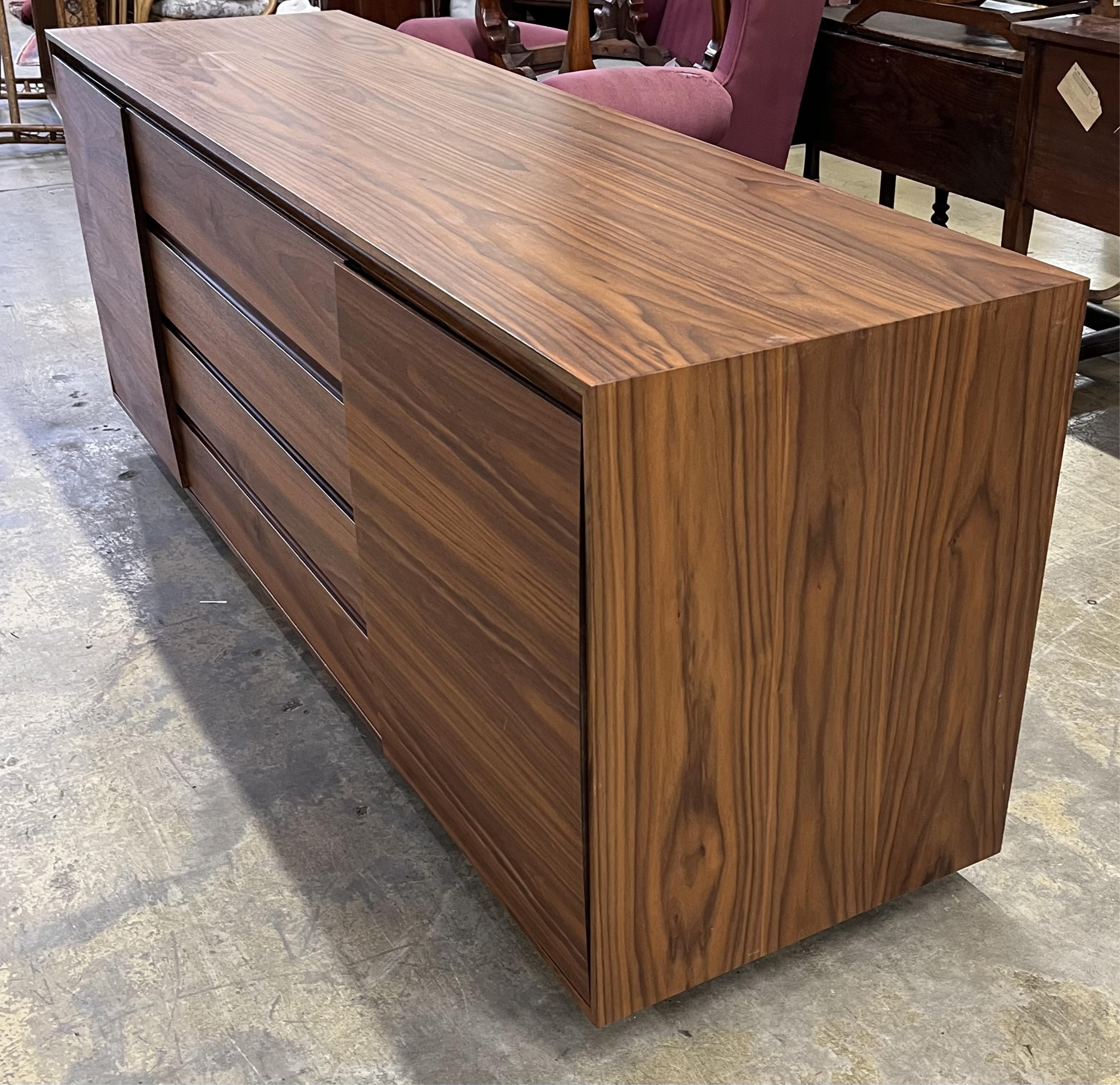 A Contemporary American black walnut sideboard, by Chartwood design Ltd., width 200cm, depth 55cm, height 77cm. Condition - fair to good